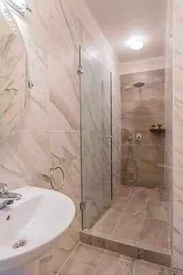 a bathroom with a shower and a sink at The Stone Manor , Noho boutique Thissio in Athens