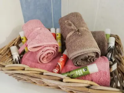 a basket filled with towels and toothbrushes at ALTHEA HOLIDAY STUDIO in Aghia Marina