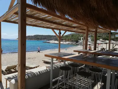 a bar on the beach with a view of the ocean at ALTHEA HOLIDAY STUDIO in Aghia Marina