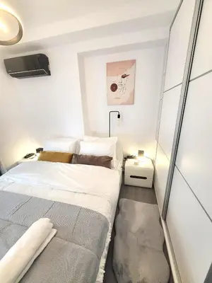 a small bedroom with a bed in a room at THE NEW Diamont of Athens in Athens
