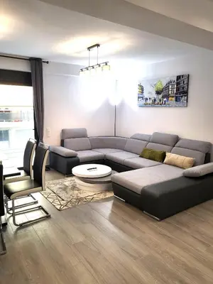 a living room with a couch and a table at THE NEW Diamont of Athens in Athens