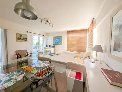 a living room with a table and a couch at Sacred Way rooftop apartment in Athens