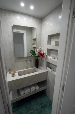a bathroom with a sink and a mirror at NobleNotes - Isabella Suite Central Athens in Athens