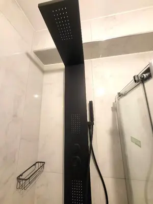 a shower with a black pole in a bathroom at Romantic Suite&GRANT Jacuzzi in Athens