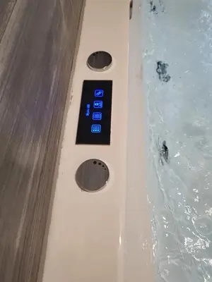 a remote control in a bath tub with water at Romantic Suite&GRANT Jacuzzi in Athens