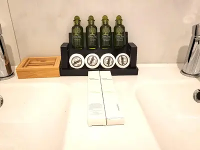 a counter with four bottles of alcohol on it at Romantic Suite&GRANT Jacuzzi in Athens