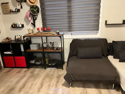 a living room with a chair and a window at Urban escape in Athens in Athens