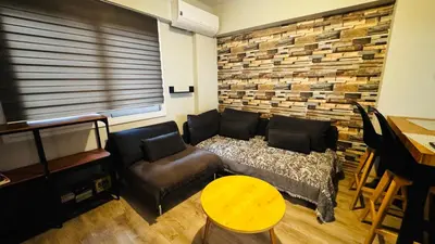 a living room with a couch and a table at Urban escape in Athens in Athens