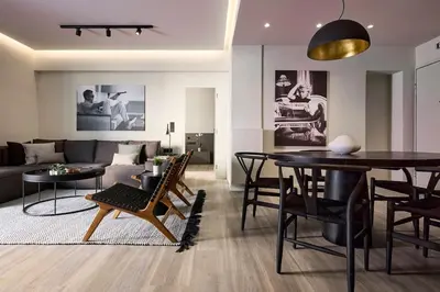 a living room with a table and a couch at Athens Metropolitan Grand Residence in Athens