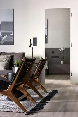 a living room with two chairs and a couch at Athens Metropolitan Grand Residence in Athens