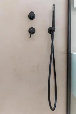 a shower head on a wall with black handles at Sunny & Luxurious Penthouse with Terrace in Athens