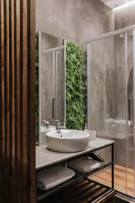 a bathroom with a sink and a mirror at Athena City Apartment in Athens