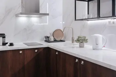 a kitchen with a sink and a counter top at Athena City Apartment in Athens