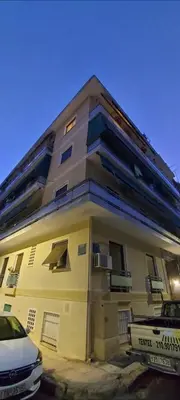 a building with a car parked in front of it at Large 1 bedroom Penthouse with Large Terrace in Athens