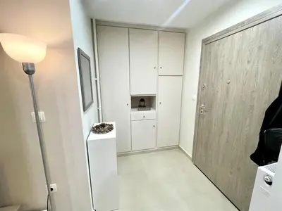 a room with a white refrigerator and a door at Elegant & Modern Flat Near Panathenaic Stadium in Athens
