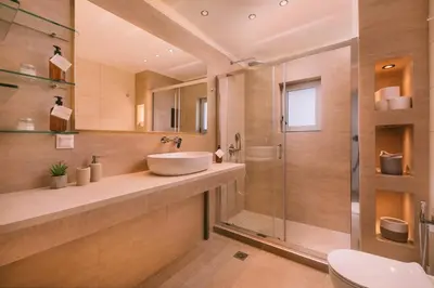 a bathroom with a sink and a shower at Villa Diamond in Lagonissi with pool & garden in Kalívia Thorikoú