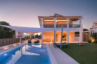 a house with a swimming pool in the backyard at Villa Diamond in Lagonissi with pool & garden in Kalívia Thorikoú