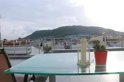 a table on a balcony with a view of a city at Elizabeth Studio in Athens