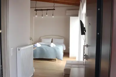 a bedroom with a bed in the middle of it at Elizabeth Studio in Athens