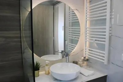 a bathroom with two sinks and a mirror at Elizabeth Studio in Athens