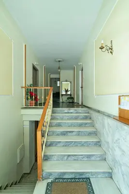 a staircase in a building with a stair case at Electra Urban Apartment Athens in Athens