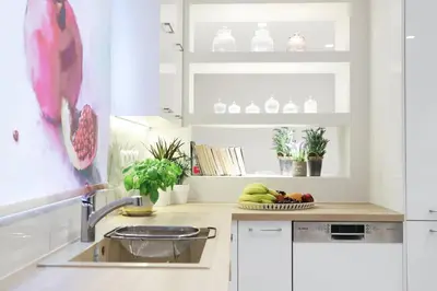 a kitchen with a sink and a bowl of fruit at Mikaella Residence in Athens
