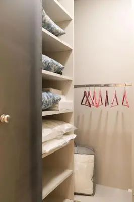 a walk in closet with shelves and hangers at Mikaella Residence in Athens