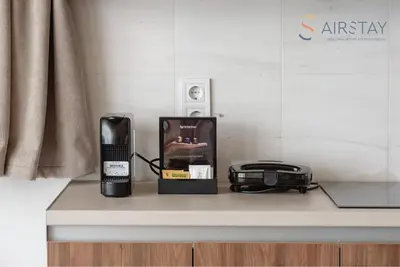 a counter with a coffee maker and a toaster at Akali Apartment airport by Airstay in Spáta