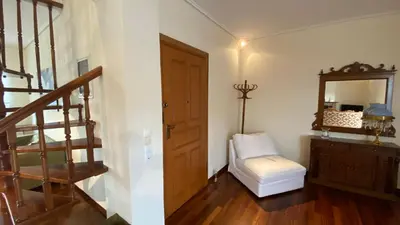 a room with a staircase and a mirror and a stool at Athens center vintage maisonete in Athens