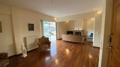 an empty living room with a couch and a fireplace at Athens center vintage maisonete in Athens