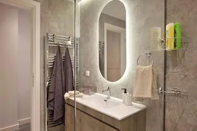 a bathroom with a sink and a mirror at Chic Apt with All Comforts in the Heart of Athens! in Athens