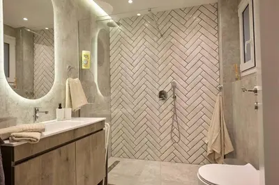 a bathroom with a toilet and a sink and a shower at Chic Apt with All Comforts in the Heart of Athens! in Athens