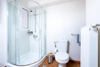 a bathroom with a shower and a toilet at Glamorous Apt in Kolonaki in Athens