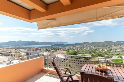 a balcony with a table and chairs and a view at Anavissos Seaview Holiday Home in Anavissos