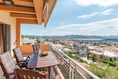 a balcony with a table and chairs and a view at Anavissos Seaview Holiday Home in Anavissos