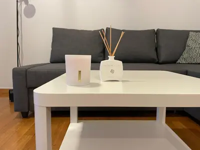 a white coffee table in front of a couch at Cityspace Apartment, Athens in Athens