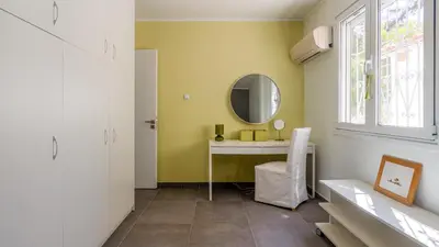 a bathroom with a sink and a mirror at Bunny island- seaview house, private garden , Lagonisi, Attika riviera by Comfortbnb in Lagonissi