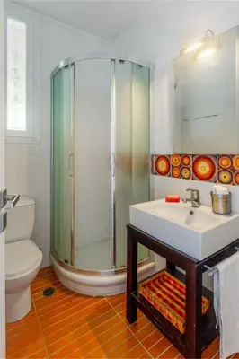 a bathroom with a shower and a sink and a toilet at Bunny island- seaview house, private garden , Lagonisi, Attika riviera by Comfortbnb in Lagonissi