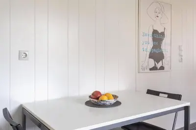 a white table with a bowl of fruit on it at Bunny island- seaview house, private garden , Lagonisi, Attika riviera by Comfortbnb in Lagonissi