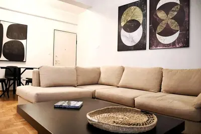 a living room with a couch and a coffee table at central Athens apartment near Kallimarmaro hosted by vasiliki in Athens