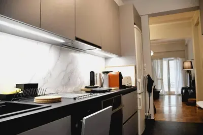 a kitchen with a counter top and a stove top oven at central Athens apartment near Kallimarmaro hosted by vasiliki in Athens