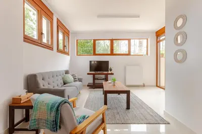 a living room with a couch and a table at Riviera Paradiso in Aghia Marina