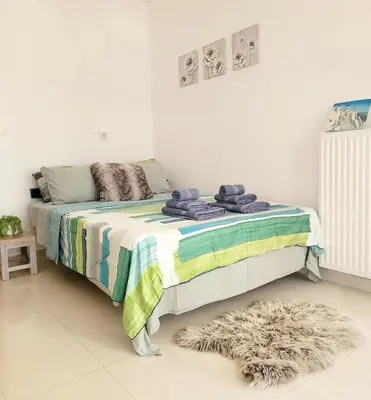 a bedroom with a bed with towels on it at Riviera Paradiso in Aghia Marina