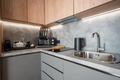 a kitchen with a sink and a counter top at Acropolis Luxury Penthouses with Majestic Views in Athens