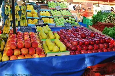 a display of fruits and vegetables in a market at Eagle's Nest Acropolis View in Athens