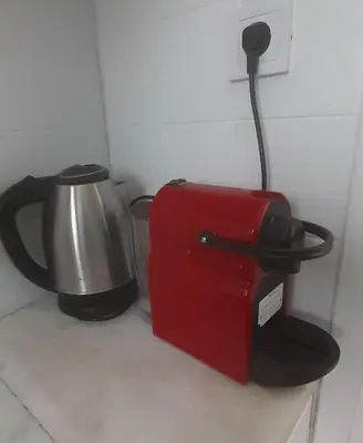 a tea kettle and a toaster on a counter at Eagle's Nest Acropolis View in Athens