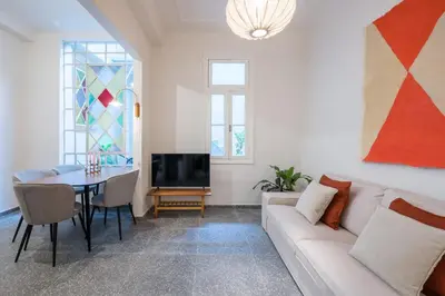 a living room with a couch and a table at Eden in Athens