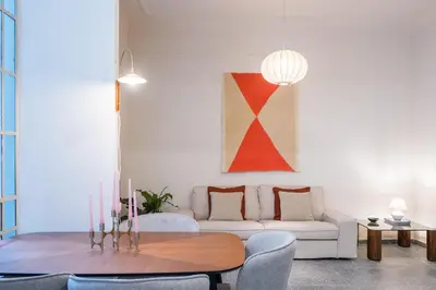 a living room with a couch and a table at Eden in Athens