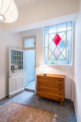 a room with a dresser and a window at Eden in Athens