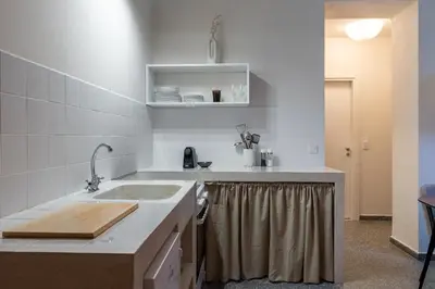a kitchen with a sink and a counter at Eden in Athens